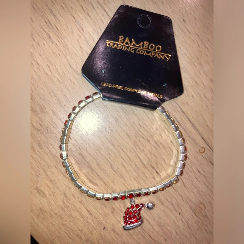Bamboo Trading Company  Red Crystal Stretch Bracelet With Santa Hat Charm  NWT